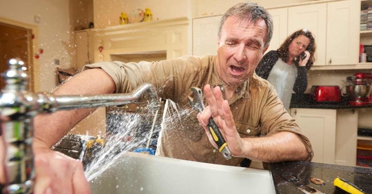 person DIYing plumbing problems